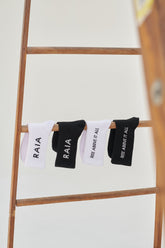 “Rise Above It All” Logo Socks - White