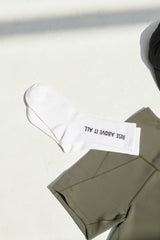 “Rise Above It All” Logo Socks - White
