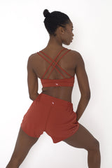 POWERFLOW LIGHT SUPPORT STRAPPY SPORTS BRA BURNT ORANGE