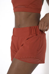 POWERFLOW HIGH-RISE RUNNING SHORTS BURNT ORANGE