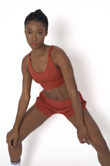 POWERFLOW LIGHT SUPPORT STRAPPY SPORTS BRA BURNT ORANGE