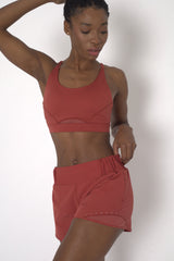 POWERFLOW LIGHT SUPPORT STRAPPY SPORTS BRA BURNT ORANGE